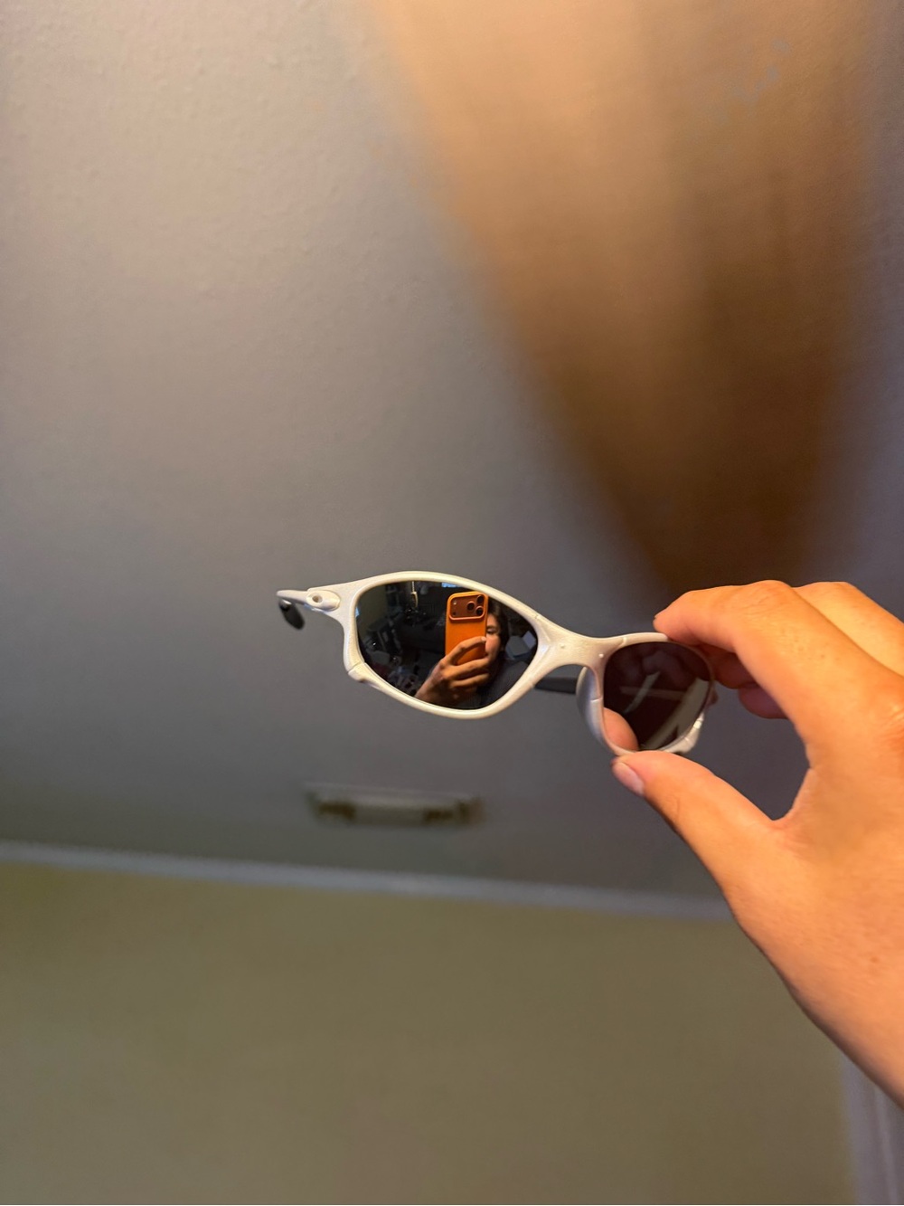 White Oval Sport Sunglasses with Dark Lenses Oakley Oakleys
